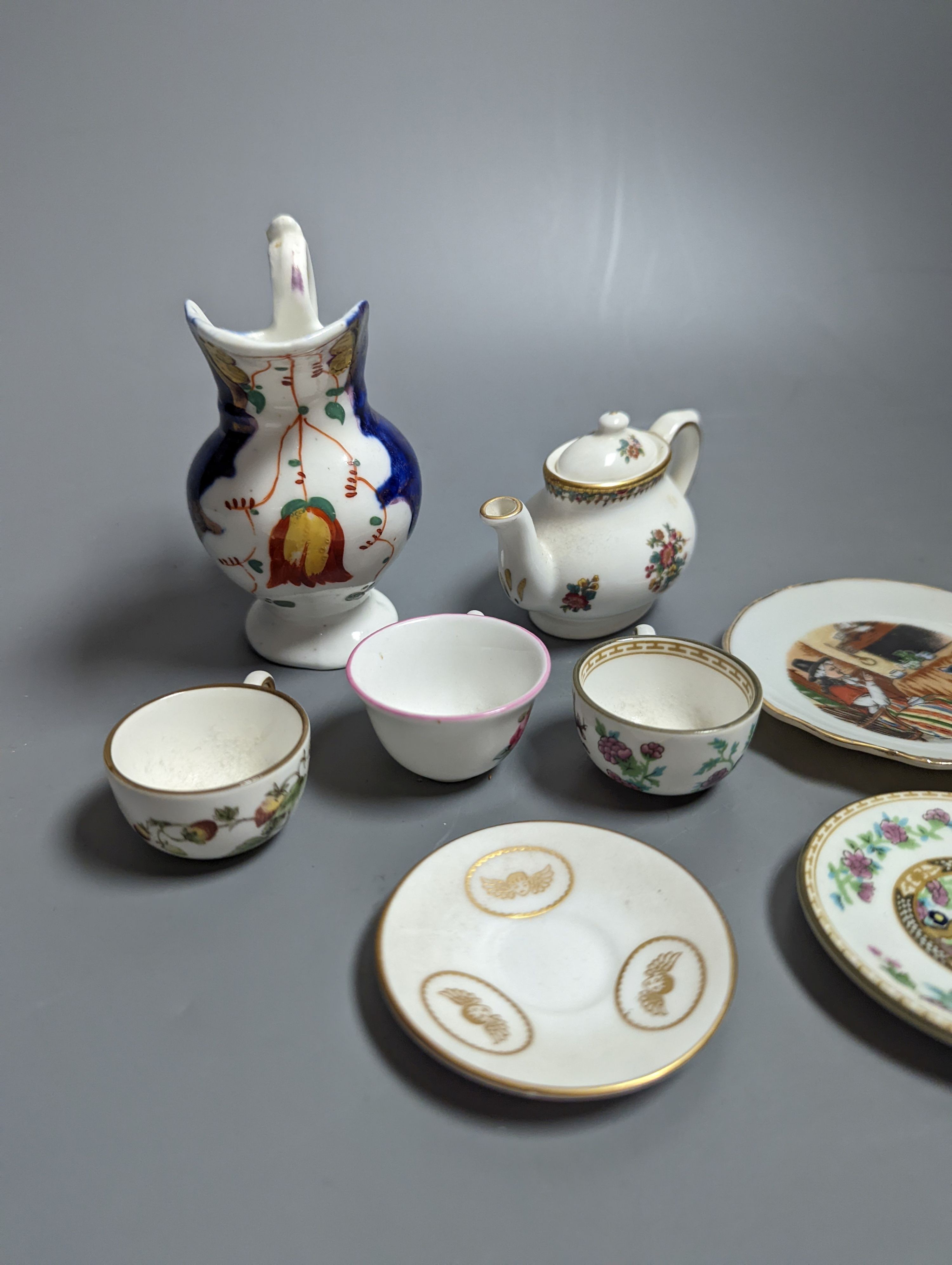 Various miniature Coalport bone china tea sets, a Staffordshire pottery moneybox and other china